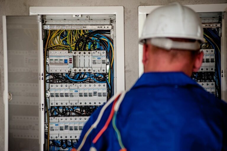 electrician working at fusebox